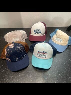 Patagonia bundle of five trucker style hats, one size adult